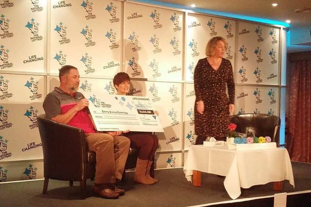 Gerry and Lisa Cannings pick up their £32.5 million cheque