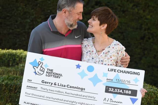 Gerry Cannings, 63, and his wife Lisa, 48, from near Peterborough celebrate at the city's Orton Hall Hotel after winning a Â£32.5 million rollover Lotto jackpot.  Photo credit: Joe Giddens/PA Wire LOTTERY_Jackpot_125544.JPG