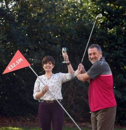 Gerry Cannings, 63, and his wife Lisa, 48, from near Peterborough, celebrate at the city's Orton Hall Hotel after winning a £32.5 million rollover Lotto jackpot. Photo credit: Joe Giddens/PA Wire LOTTERY_Jackpot_124313A.JPG