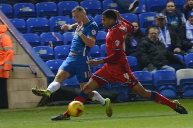 Posh man-of-the-match Marcus Maddison sends in a cross against Oldham. Photo: Joe Dent/theposh.com.