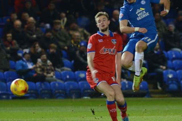 Posh man-of-match Marcus Maddison shoots at goal against Oldham. Photo: David Lowndes.