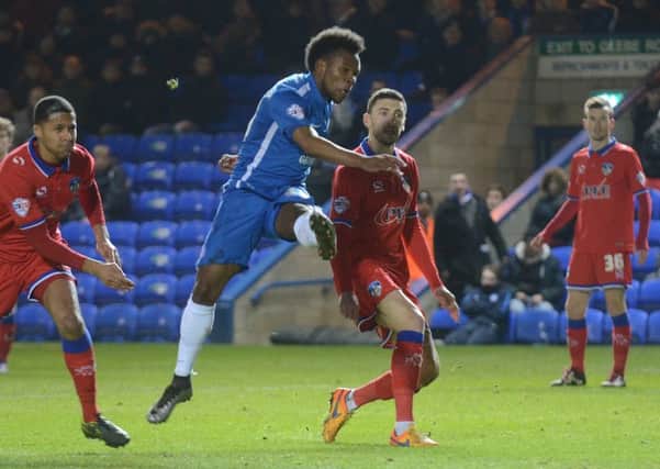 Posh substitute Shaquile Coulthirst shoots wide late in the game against Oldham. Photo: David Lowndes.