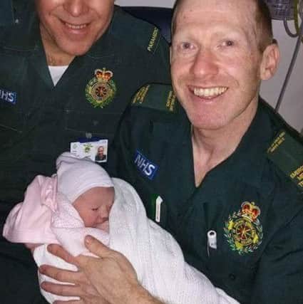 Paramedics Chris Porsz and Simon Branaghan with new arrival Alexa
