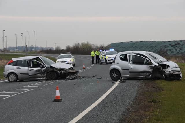 Police at the scene where a Ford Focus and Citreon were in collision on the A16 in Crowland.  Photo by David Lowndes.