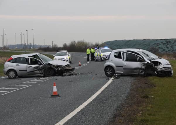 Police at the scene where a Ford Focus and Citreon were in collision on the A16 in Crowland.  Photo by David Lowndes.