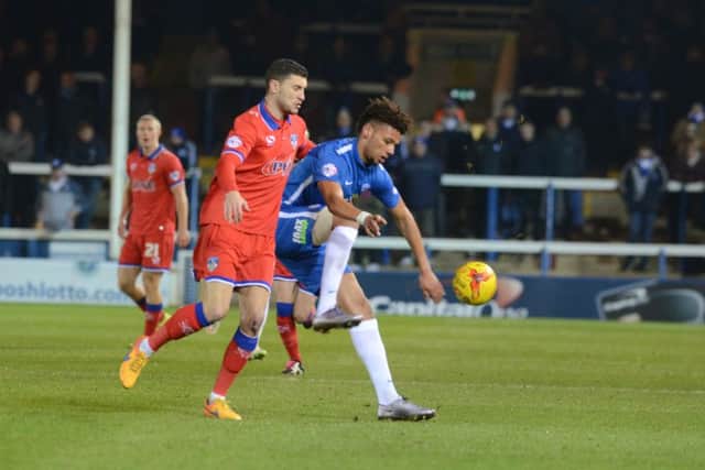 Posh striker Lee Angol in action against Oldham. Photo: David Lowndes.