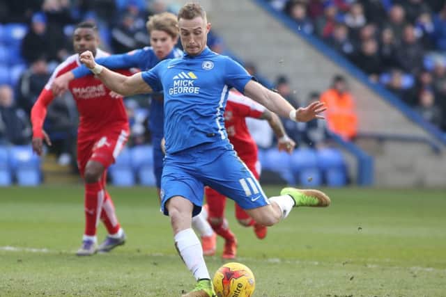 Marcus Maddison shoots Posh in front against Swindon from the penalty spot. Photo: Joe Dent/theposh.com.