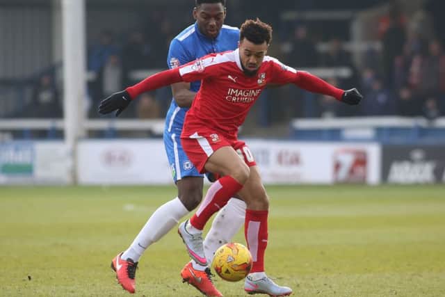 Posh central defender Ricardo Santos challenges Swindin striker Nicky Ajose for possession. Photo: Joe Dent/theposh.com.