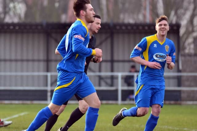 Tom Waumsley trots back to the centre circle after one of his three goals for Spalding United against Goole. :