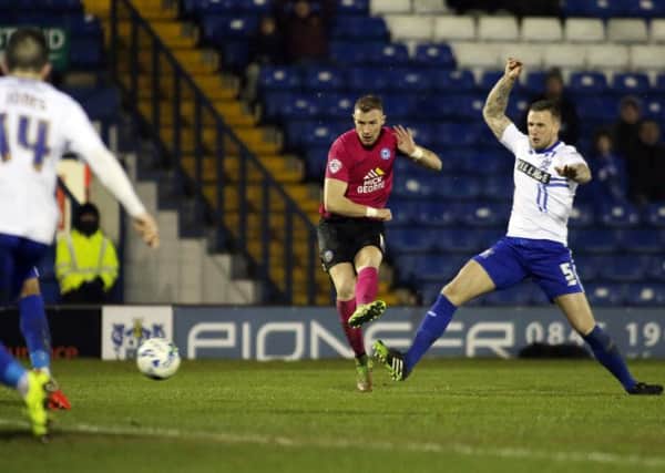Marcus Maddison of Peterborough United scores his side's only goal of the game. Picture: Joe Dent