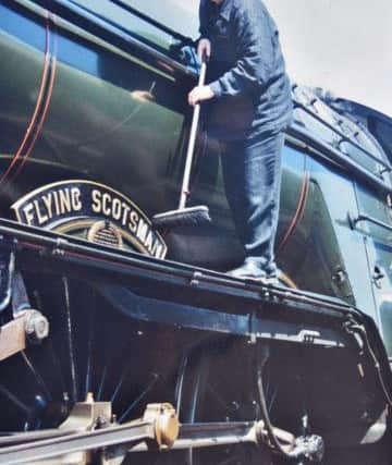 Pete Waterman sprucing up The Flying Scotsman at Nene Valley Railway