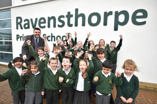 Head teacher Martin Fry with some of the pupils from Ravensthorpe primary school after their recent OFSTED EMN-160103-163529009