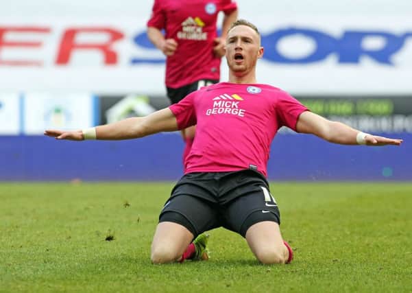 Marcus Maddison of Peterborough United celebrates scoring his goal. Picture: Joe Dent