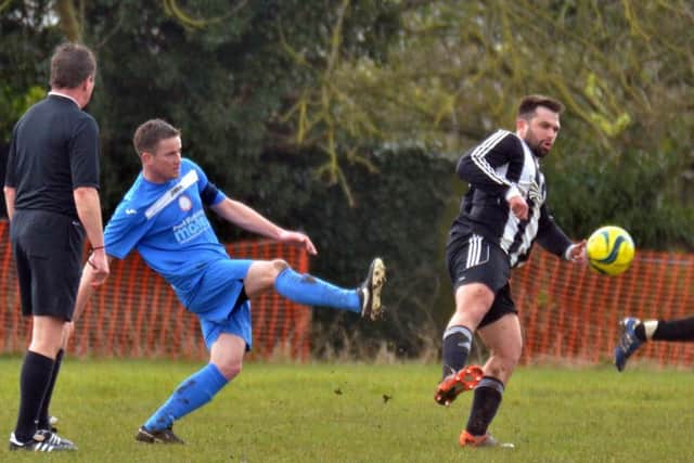 Action from Pinchbeck (blue) v Langtoft. Photo: Tim Wilson.