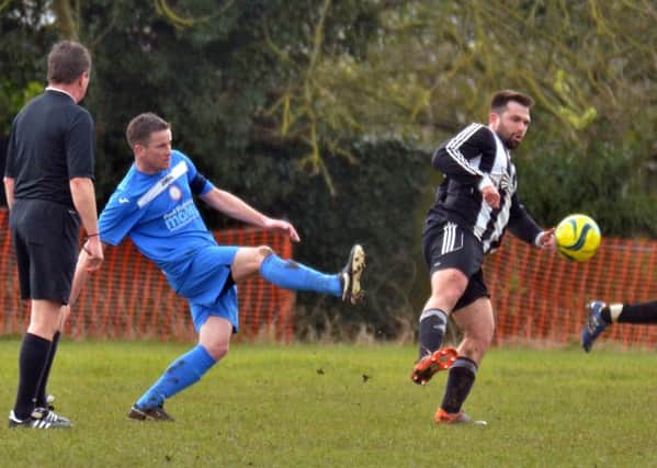 Action from Pinchbeck (blue) v Langtoft. Photo: Tim Wilson.