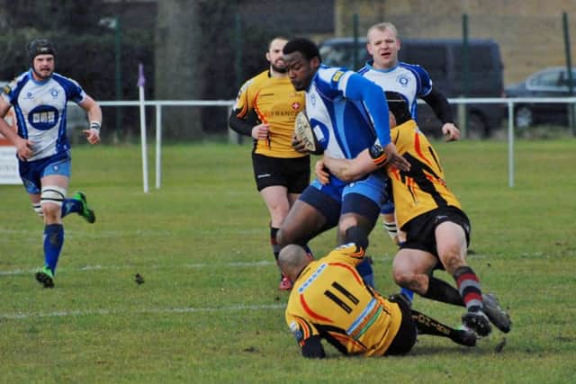 Vernon Horne is tackled by two Birmingham players. Picture: Kevin Goodacre