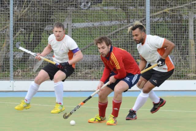 Joe Finding (red) will be a kay man for Peterborough Town against Wapping. Photo: David Lowndes.