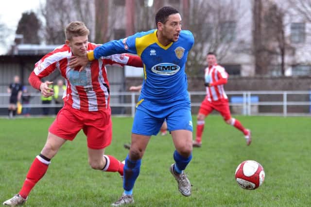 Jamie Graham (blue) scored for Peterborough Sports Reserves against Deeping Rangers Reserves. Photo: Tim Wilson.
