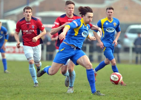 Action from Spalding United's (blue) 1-1 draw with Rugby. Photo: Tim Wilson.