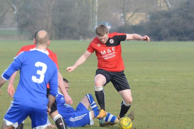 Action from ICA Reserves v Stamford Lions (red). Photo: David Lowndes.