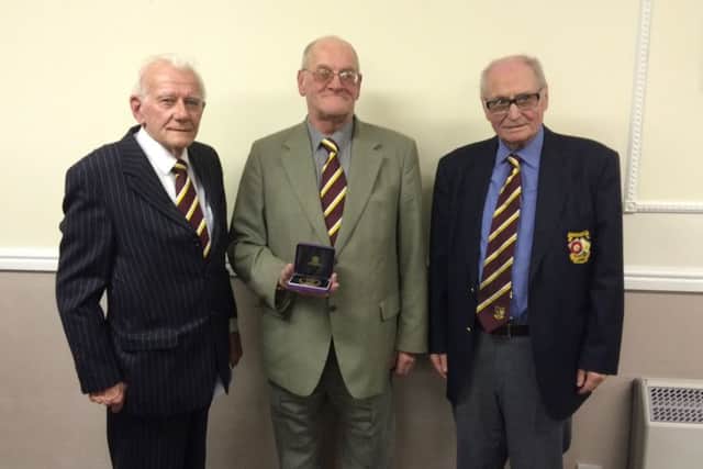 Nick Titman received his award from Derek Vernum (left) and Brian Walden.