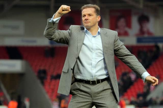 Posh boss Graham Westley salutes the Posh fans after a dramatic win at Doncaster. Photo: Joe Dent/theposh.com.