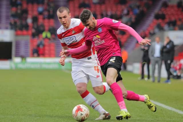 Michael Smith in action for Posh at Doncaster. Photo: Joe Dent/theposh.com.