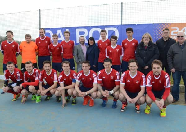 DALROD managing director David Lane (centre, back row) with the City of Peterborough Hockey Club team, and sports club officials, before a HA Cup semi-final with Beeston. Photo: David Lowndes.