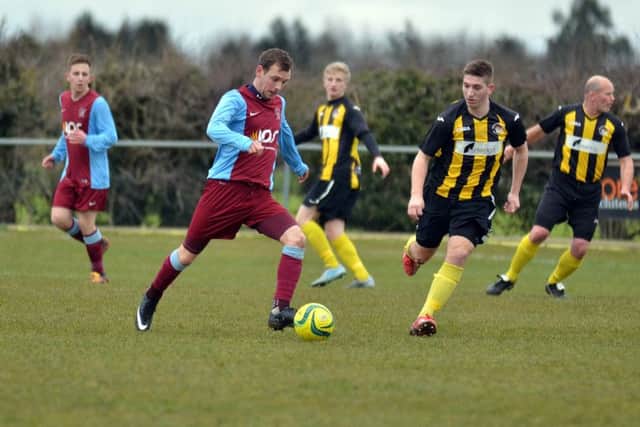 Action from Deeping Rangers Reserves v Holbeach United Reserves (stripes). Photo: Tim Wilson.