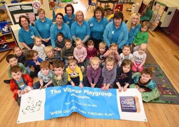 Staff and children at Werrington Village Playgroup which has been rated Oustanding by OFSTED .