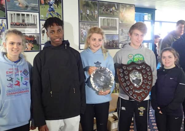 Harriers cross-country runners who did well at RAF Cranwell. From the left are Imogen Woodard, Denzel Mposu, Olivia Ozkan (holding Under 15 girls trophy), Ollie Bowling (holding Under 17 mens trophy) and Beth Goymour.