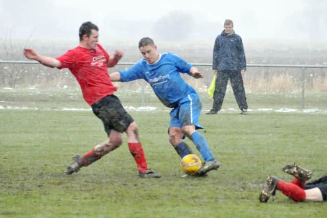 Ian Bradbury (blue) scored the winning goal for Moulton Harrox at Peterborough Sports Reserves.