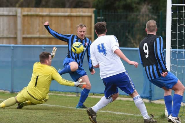 Action from Peterborough Sports Reserves (white) v Whittlesey Athletic. Photo: David Lowndes.