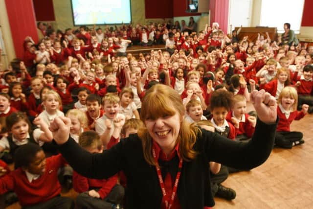 Head teacher Mrs Becky Waters with pupils at Dogsthorpe infants school after their Good OFSTED EMN-160323-181101009