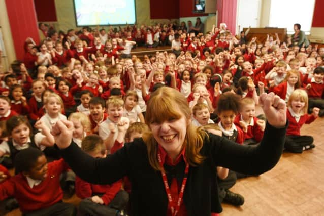 Head teacher Mrs Becky Waters with pupils at Dogsthorpe infants school after their Good OFSTED EMN-160323-181101009