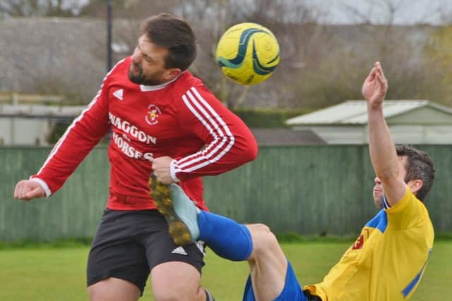 Action from Langtoft United (red) against Stamford Lions in the PFA cup semi-final. Photo: David Lowndes.