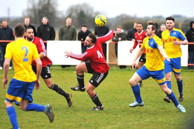 Langtoft United (red) during their PFA Cup semi-final win over Stamford Lions. Photo: Tim Wilson.