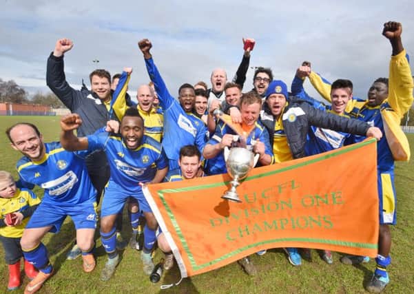 Peterborough Sports' players and staff celebrate their United Counties Division One title success. Photo David Lowndes.