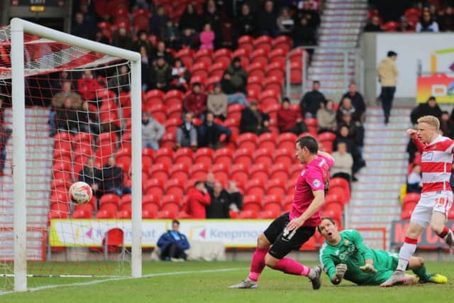 Aaron Williams scores for Posh at Doncaster. Photo: Joe Dent/theposh.com.