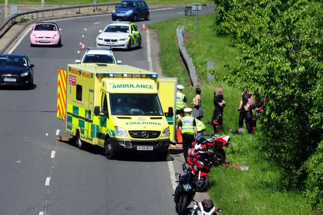 Police and ambulance attend the scene of a motorcycle crash on the Paston Parkway ENGEMN00120130527120329