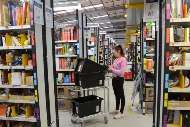 Staff at work at Amazon Fulfilment Centre, in Peterborough.  EMN-151126-163036009