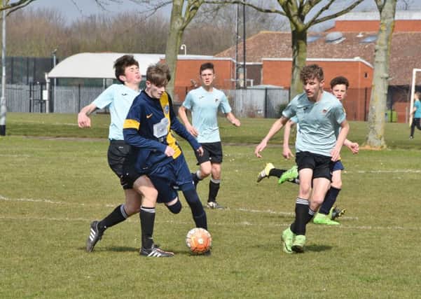 Action from  the game between Glinton and Northborough Under 15s and Holbeach, which ended all square at 2-2.