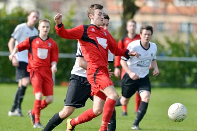 Action from Bourne's (red) 3-0 win over Bugbrooke St Michaels over the weekend. Photo: Tim Wilson.