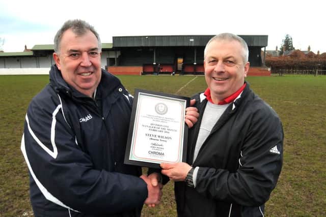 Bourne manager Steve Wilson (right) with a United Counties Division One manager of the month award.