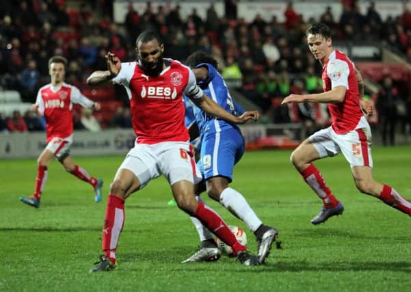 Striker Shaquile Coulthirst is fouled by Fleetwood's Nathan Pond to earn Posh a penalty. Photo: Joe Dent/theposh.com.