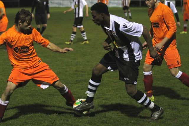 Peterborough Northern Star goalscorer Jezz Goldson-Williams (stripes) in action against Kirby Muxloe. Photo: Tim Gates.
