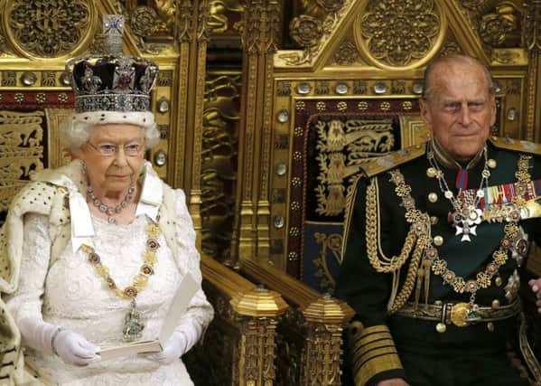 Queen Elizabeth II sits alongside the Duke of Edinburgh as she delivers her speech in the House of Lords during the State Opening of Parliament at the Palace of Westminster in London. PRESS ASSOCIATION Photo. Picture date: Wednesday May 27, 2015. See PA story POLITICS Speech. Photo credit should read: Alastair Grant/PA Wire PPP-150527-124642001