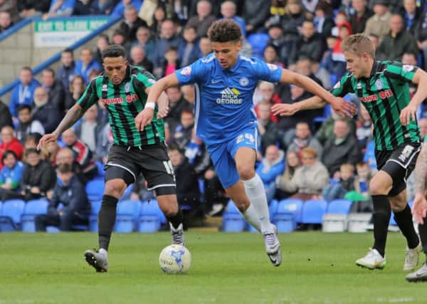 Lee Angol of Peterborough United battles with Nathaniel Mendez-Laing of Rochdale. Picture: Joe Dent