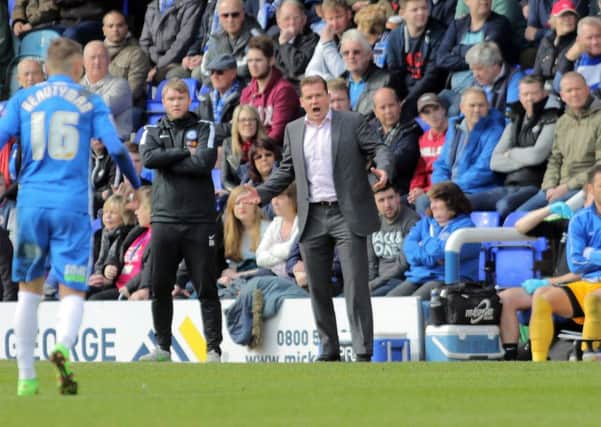 Peterborough United manager Graham Westley encourages his players from the touchline. Picture: Joe Dent