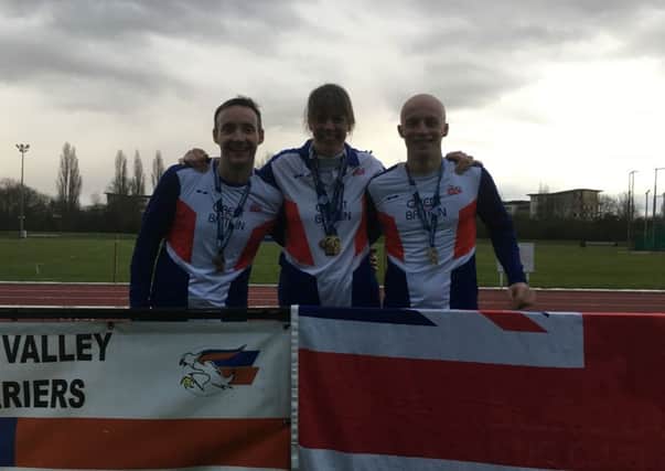 Nene Valley Harriers with medals they won at the European Masters Indoor Championships. From the left they are Julian Smith, Andrea Jenkins and David Brown.